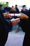 student being handed a diploma